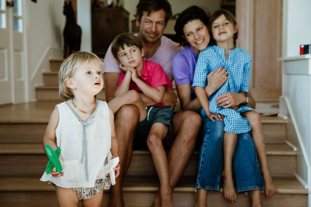 Notice how the clean gingham pattern adds interest, and compliments the delicate floral print of the little girls shorts. The rest of the family are dressed in simple yet stylish outfits.